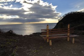 San Juan del Sur overlooking the beach at sunset with a bench in the foreground – Best Places In The World To Retire – International Living